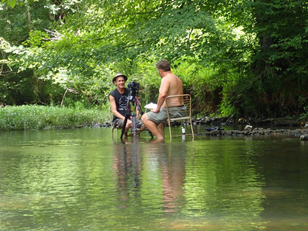 Modes interviews artist Butch Anthony sitting in Cypress Creek on a hot day in Florence, Alabama in 2016.