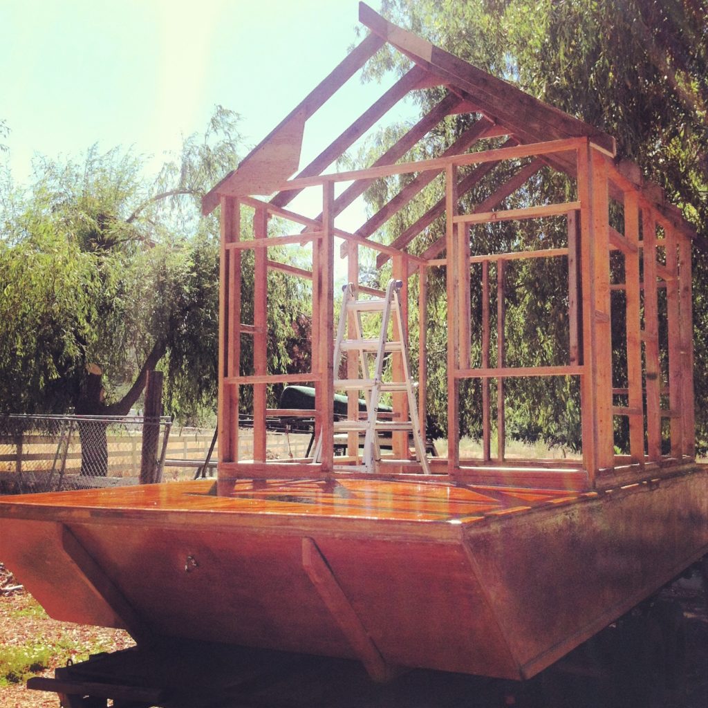 Shantyboat cabin framing comes together from reclaimeddd materials
